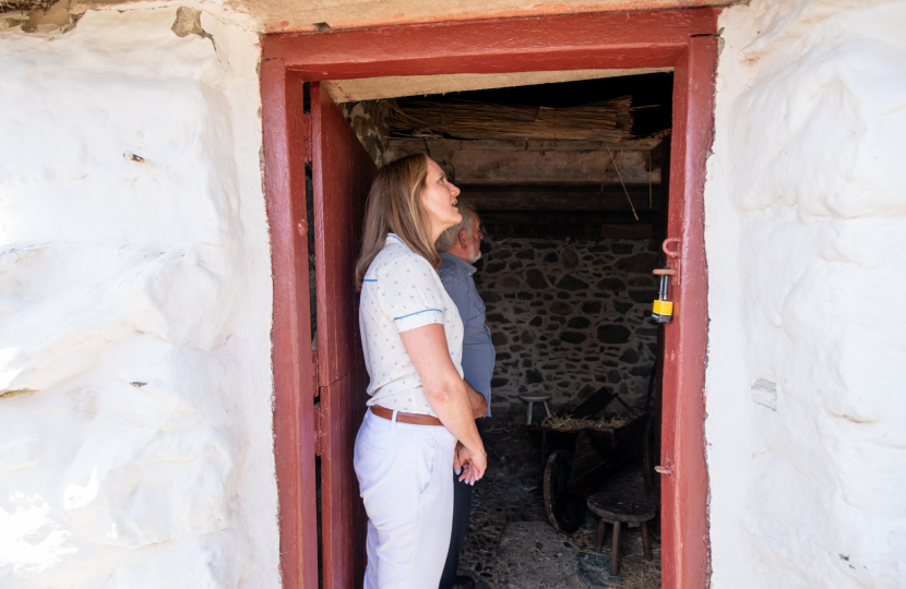 Virginia Crosbie in the doorway of Swtan Cottage